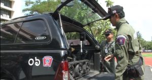 CALIBER T5 EOD/SWAT Robot in the back of a sport utility truck truck