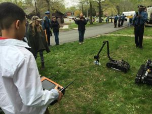 Kid using Mini-CALIBER® Police robot